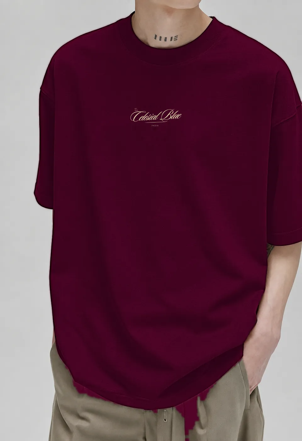 Model in the burgundy Classic oversized t-shirt, three-quarter view