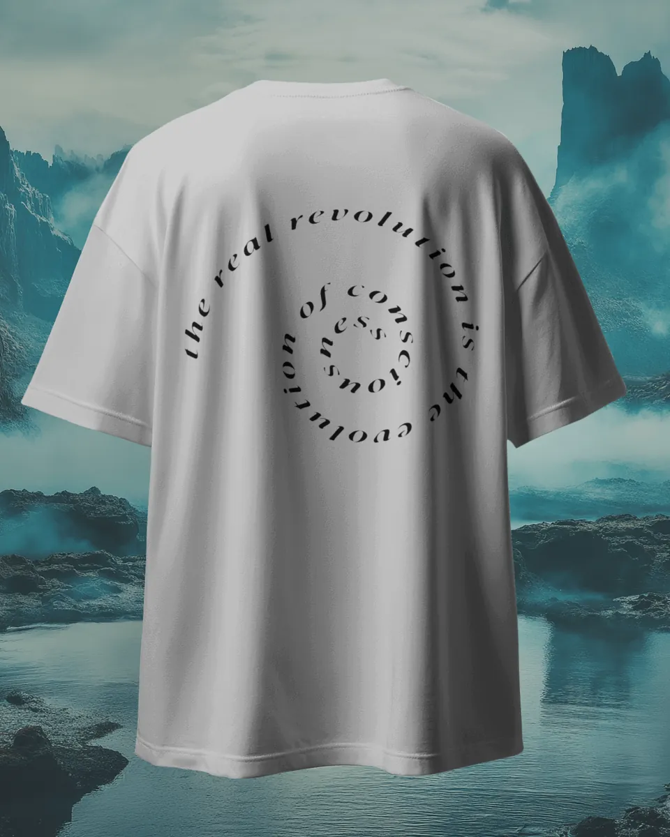 Back of the Saint White Consciousness t-shirt with the spiral text print, by a misty lake