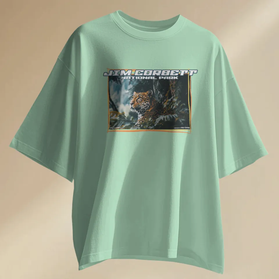 Jade green oversized t-shirt with the Jim Corbett leopard print, laid flat