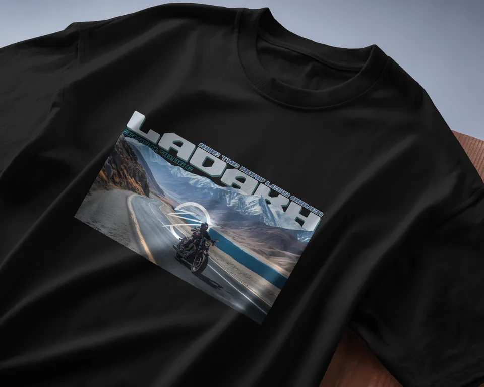 Black oversized t-shirt with the Ladakh road print, angled close-up