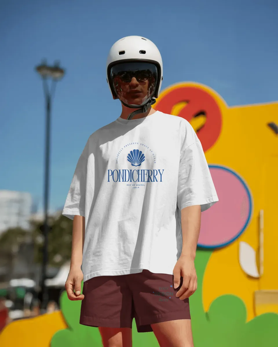Model in a helmet wearing the white Pondicherry oversized t-shirt