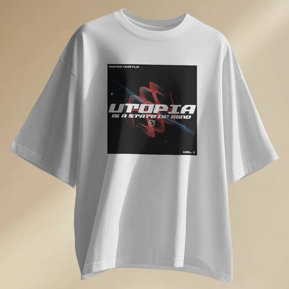 White oversized t-shirt with the Utopia print, laid flat
