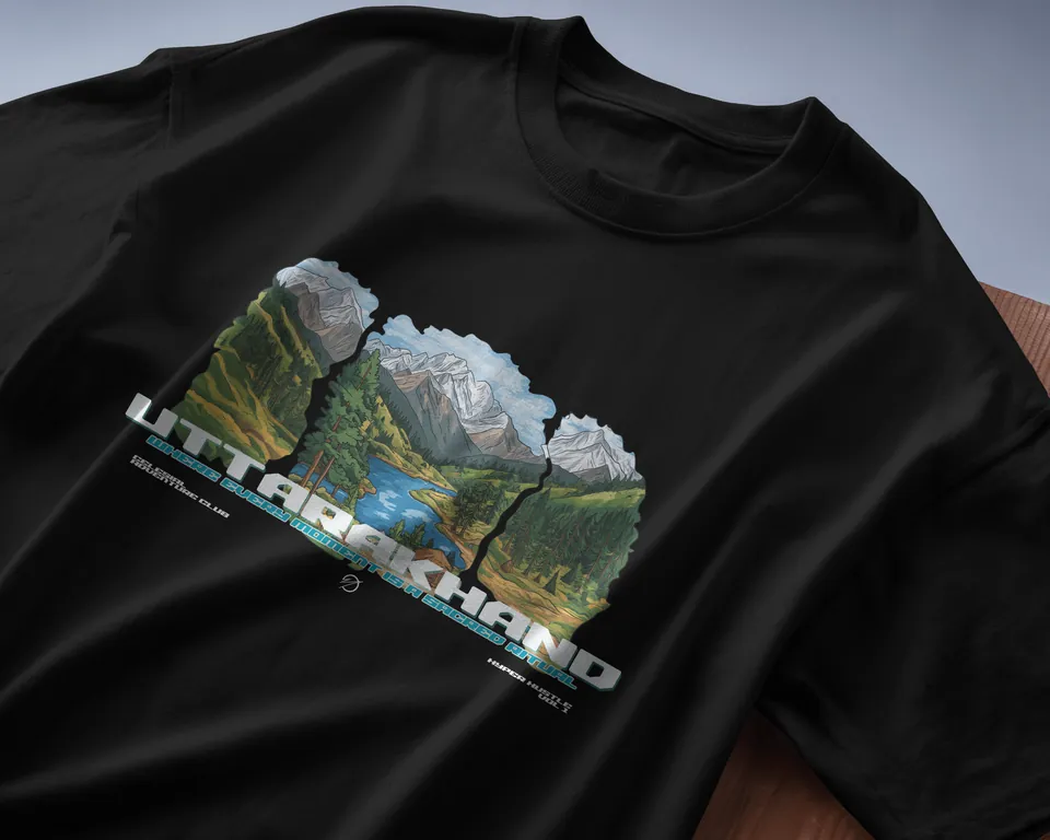 Black oversized t-shirt with the Uttarakhand mountain print, angled close-up